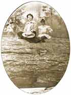 Opal Finnel and Rilda Martin Moses on Old Growth Log