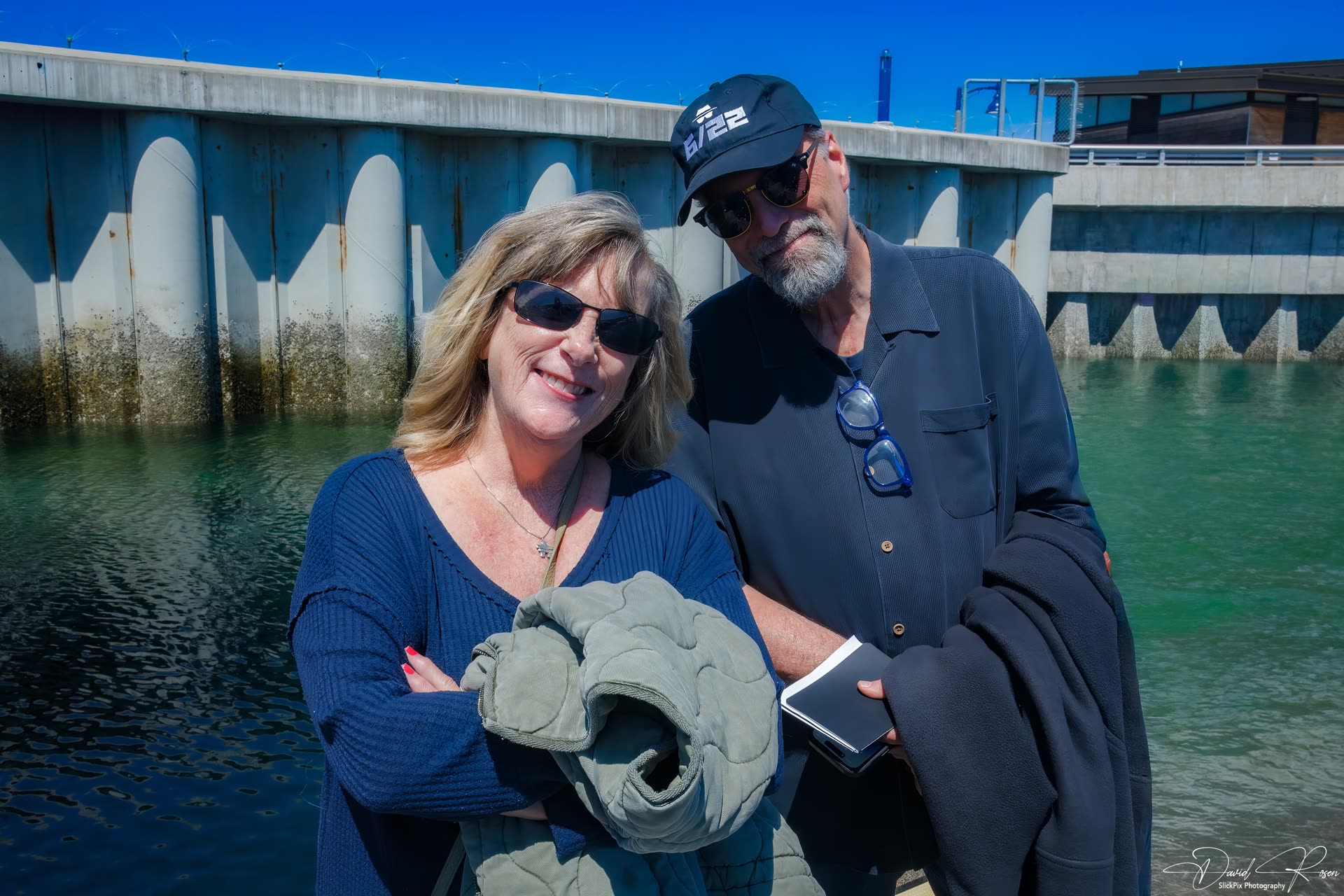 Cruise guests pose together while waiting at the marina.