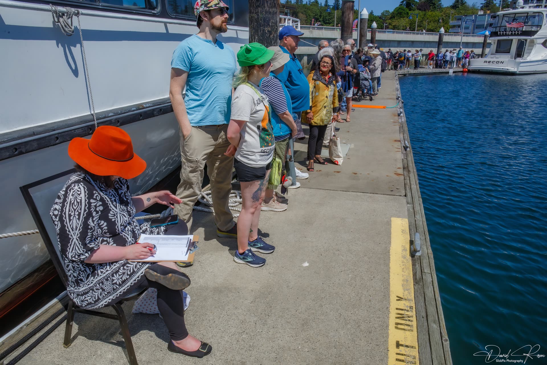 Passengers wait in line beside the Lady Mary.