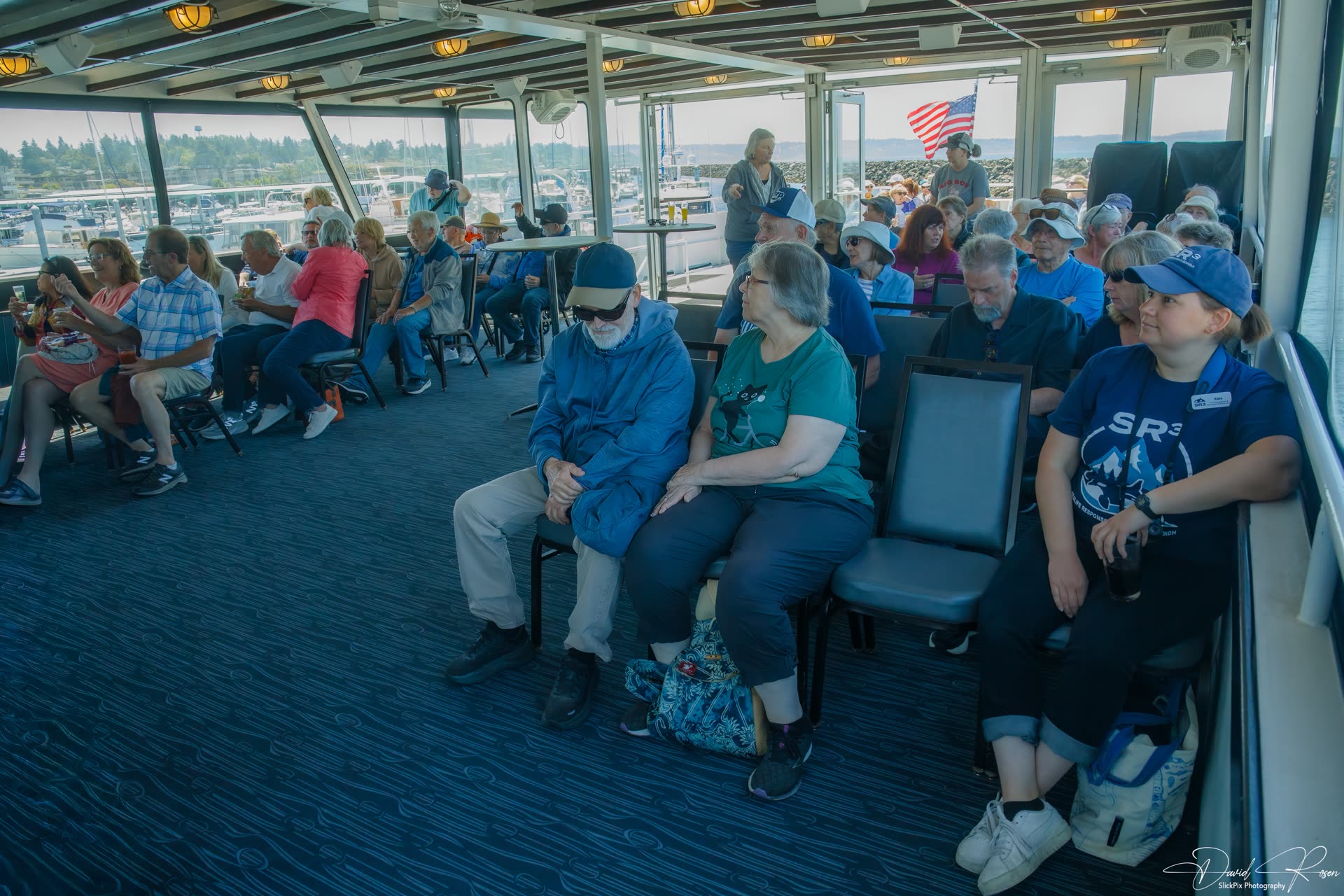 Wide panoramic view of passengers seated inside the Lady Mary.