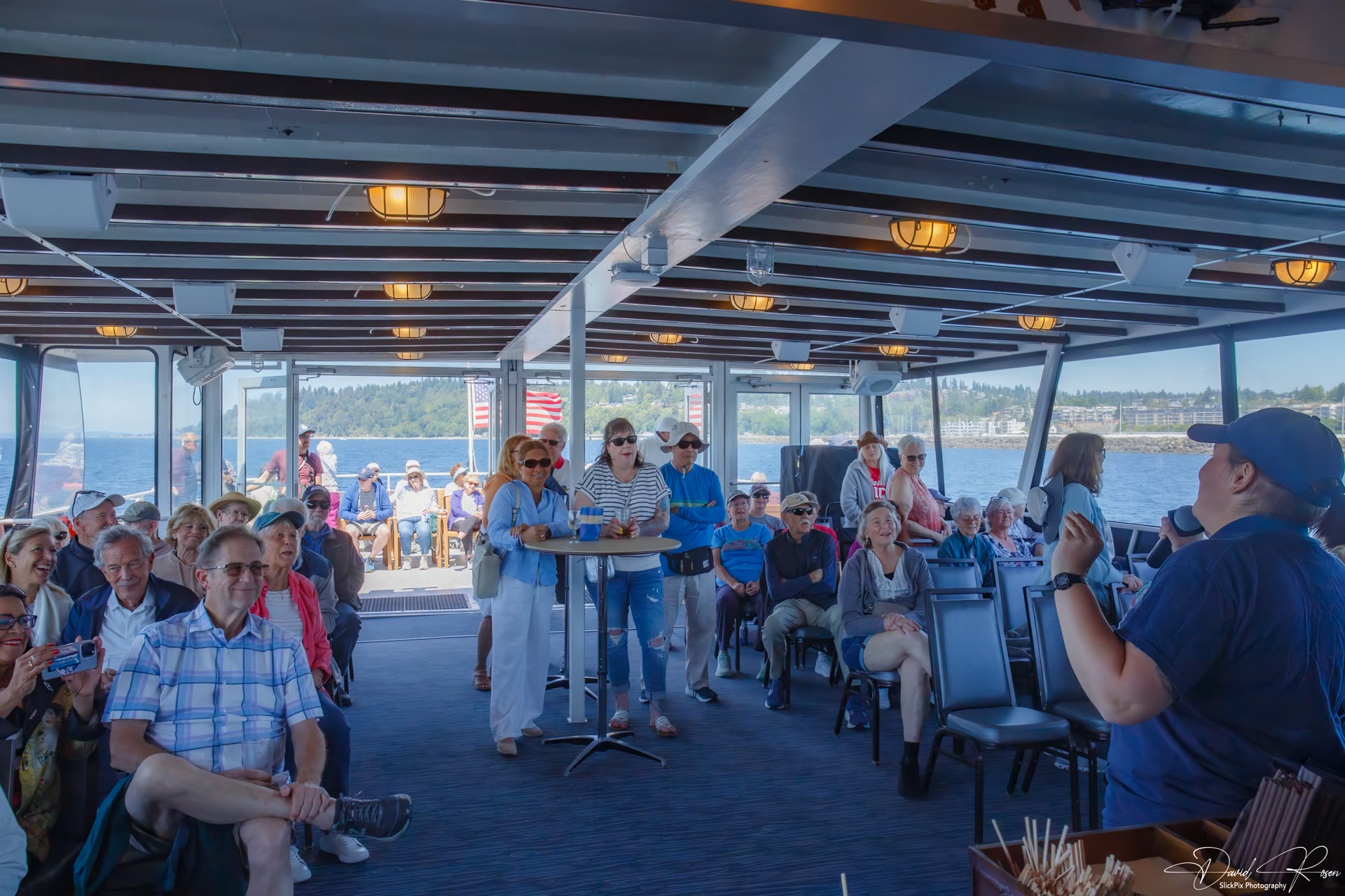 Passengers face the presenter during the onboard program.