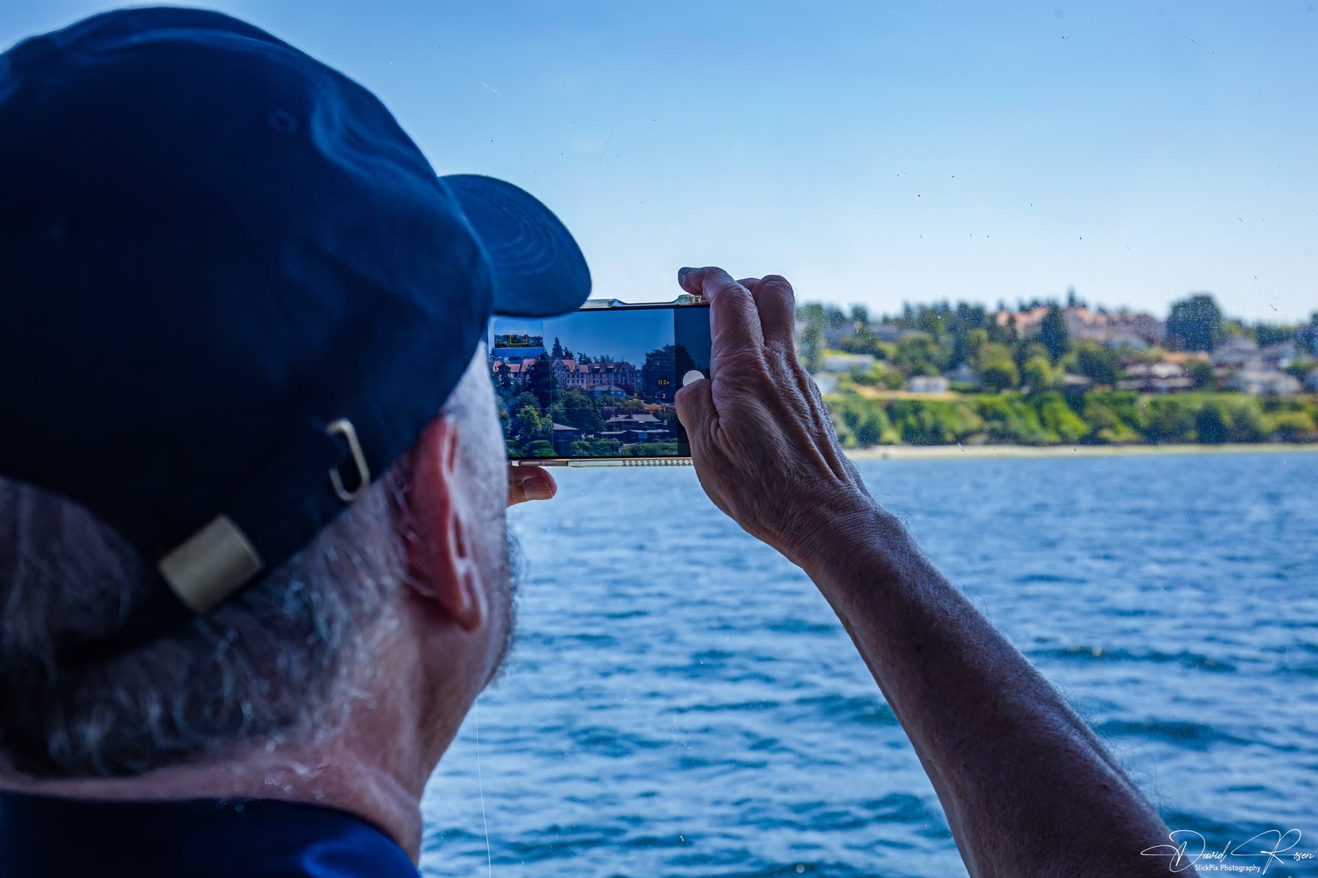 A passenger takes a photograph from the vessel.