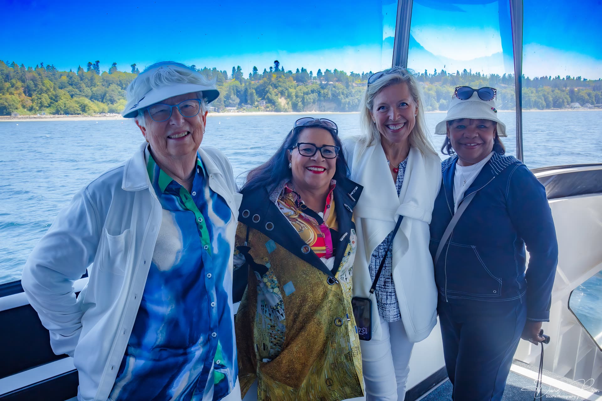 Four cruise guests pose together inside the vessel.