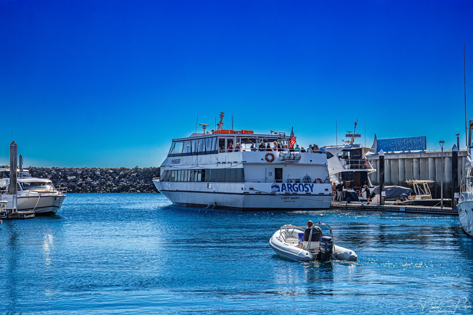 Lady Mary near the marina with a small boat in the foreground.